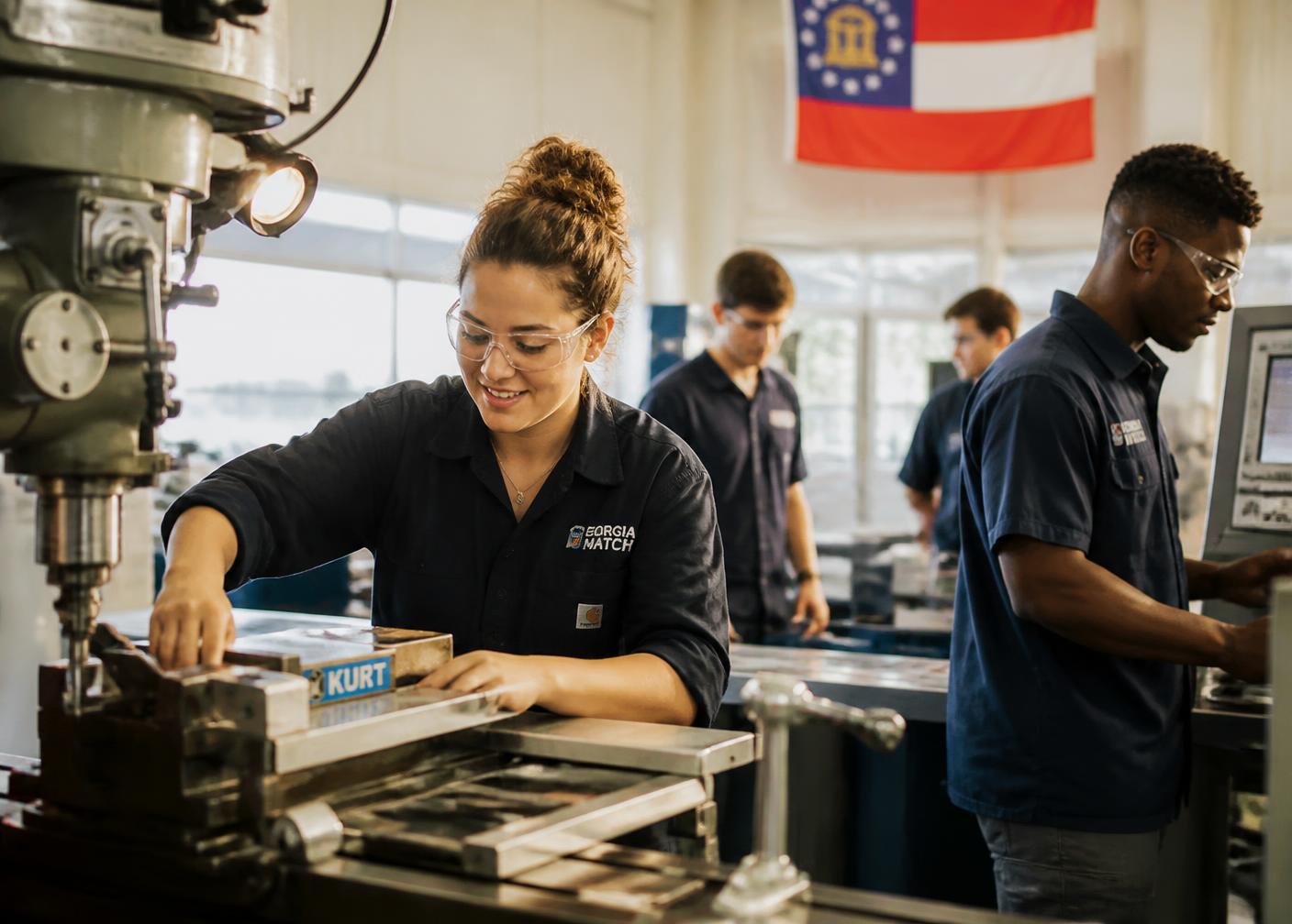 Students training on CNC and manufacturing equipment in a modern rural Georgia workforce academy
